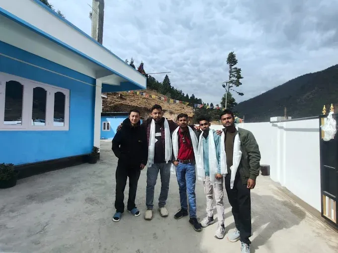 Guests standing in the courtyard of Awoochopa Homestay Dirang