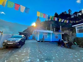 Sunset view from Awoochopa Homestay Dirang courtyard